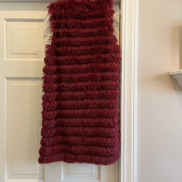 Red vest. Feathers? Fur? Not sure but really soft - Picture 2 of 3